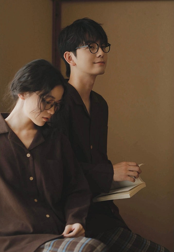 Couple wearing coordinating brown long-sleeve pajama tops