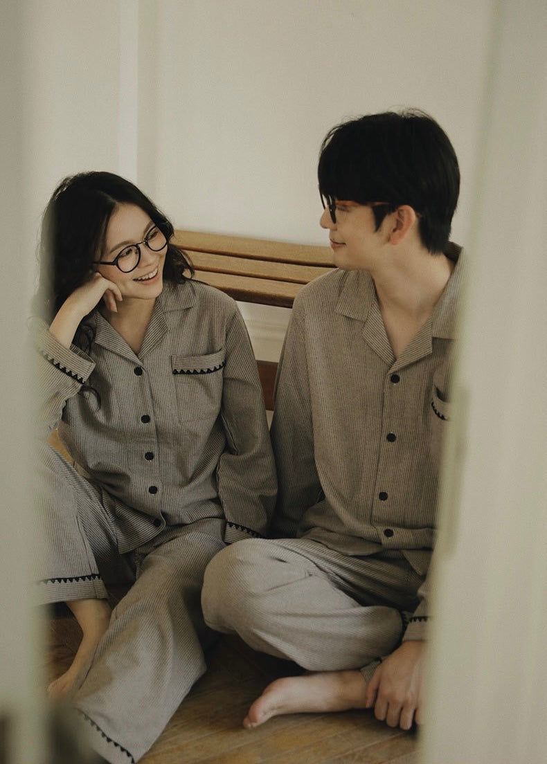 Couple relaxing together in matching taupe cotton pajamas