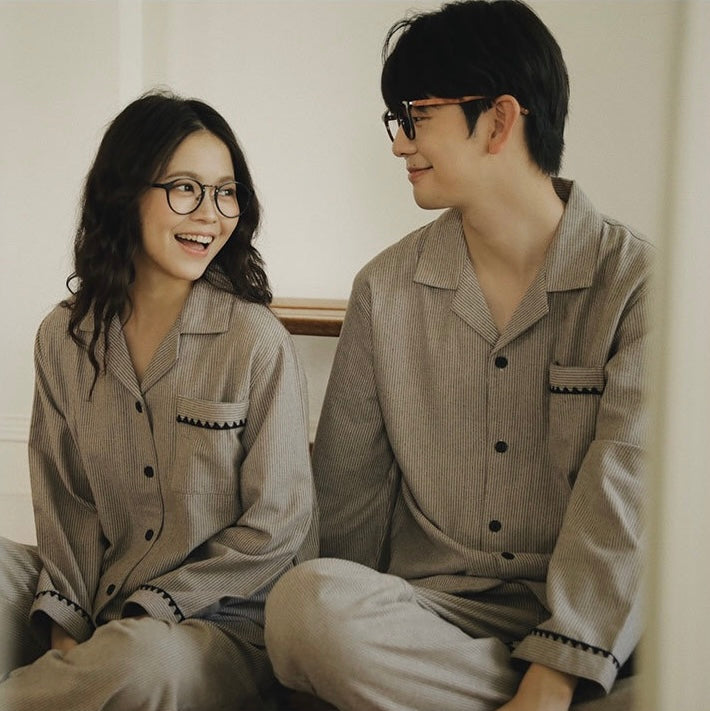 Close view of coordinating striped pajama tops for women and men