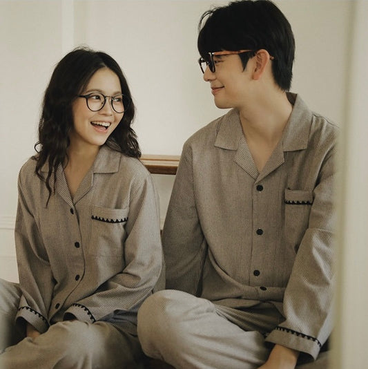 Close view of coordinating striped pajama tops for women and men